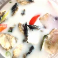 Tom Kha Soup ต้มข่า · Coconut broth soup with mushrooms and galangal.