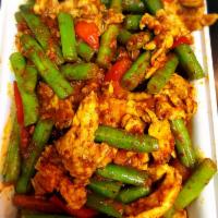 Sauteed Prik King Sauce · Sauteed Thai curry paste, bell peppers, lime leaves and string bean. Served with jasmine ric...