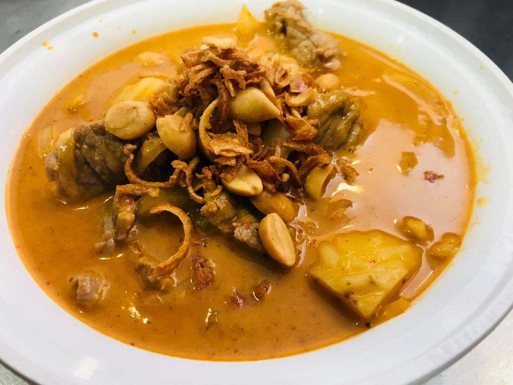 Massaman Curry · Coconut curry, roasted peanuts, onions and potatoes. Served with jasmine rice. Spicy.