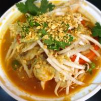 Tom Yum Noodle Soup · Steamed rice noodles in tom yum soup with bean sprouts, scallion and grounded peanut. Spicy.