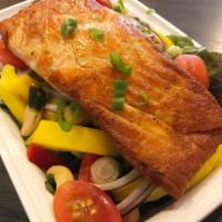 Salmon Mango Salad · Pan fried salmon with fresh mango salad and spicy lime dressing. Served with jasmine rice.