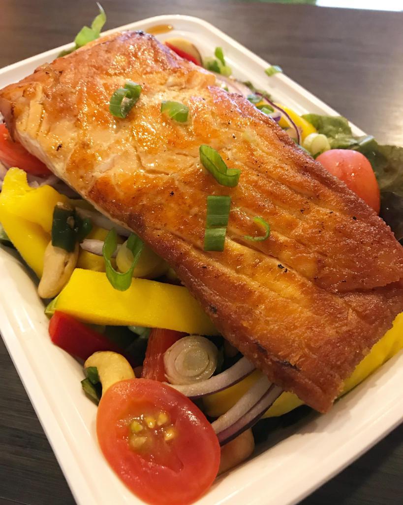 Salmon Mango Salad · Pan fried salmon with fresh mango salad and spicy lime dressing. Served with jasmine rice.