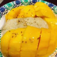 Mango Sticky Rice · Coconut sticky rice serve with yellow mango topping with sesame seed