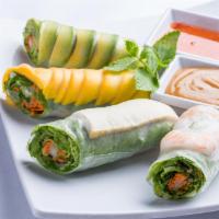 2 Pieces Combo Fresh Spring Rolls · Rice paper membrane wrap of mixed green veggies. Two rolls cut in half. Served with sweet ch...