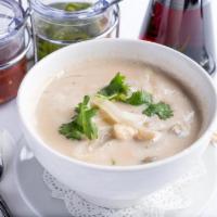 Tom Kha Soup · Creamy coconut soup with Thai herbs, onions, mushrooms and cilantro.