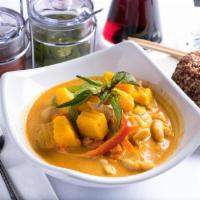 Pumpkin Curry · Pumpkin, carrots, bell peppers and sweet basil. Simmered in red curry and coconut milk. Spicy.