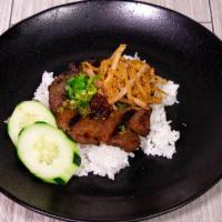 40. Grilled Pork Chop and Julienne Pork Skin Rice Plate · Dished up with white rice, slices of cucumbers and tomatoes along with pickled radishes. Ser...