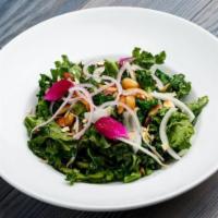 Kale Salad · Sauteed kale, onions, bean sprouts, soy sauce, roasted garlic and almonds.