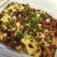 Chili Cheese Fries · Topped with chicken chili, melted cheese, bacon and scallions.