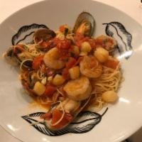 Capellini Di Mare · Fresh scallops, shrimp, clams and mussels in a lite cream tomato sauce.