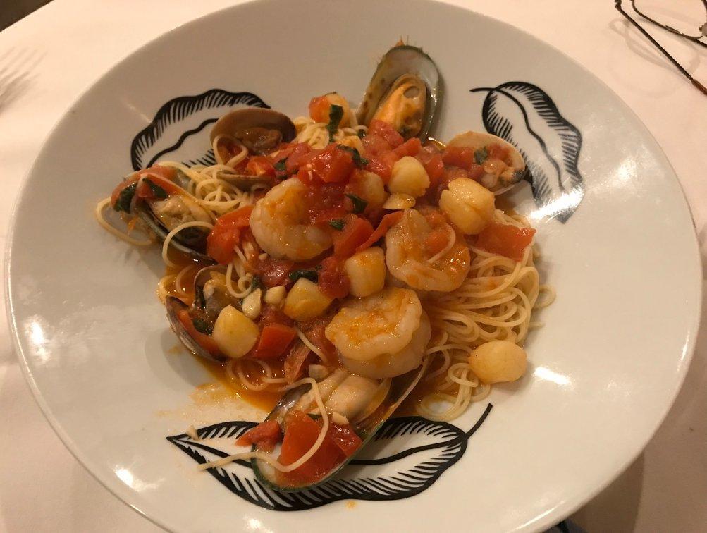 Capellini Di Mare · Fresh scallops, shrimp, clams and mussels in a lite cream tomato sauce.