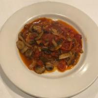 Veal Pizzaiola · Sauteed veal with onions, peppers and assorted mushrooms in a light tomato sauce.