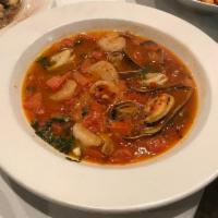 Gamberi Fradiavolo · Gulf shrimp sauted with garlic, spicy fresh tomato, clams, and mussels.