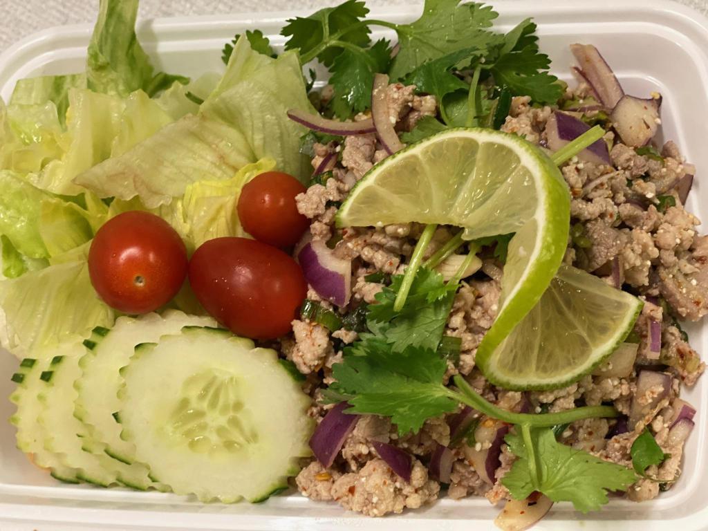 Y5. Larb Pork · Ground pork mixed with peanuts, red onion, lime juice and Thai herbs. Hot and spicy.
