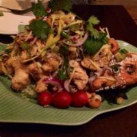 M7. Fish in the Garden · Fried whole red snapper topped with cashew nuts, green mango, lemongrass, lime leaf, onions ...