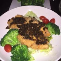 F3. Salmon Garlic · Fried salmon topped with garlic sauce and served with steamed broccoli and jasmine rice.