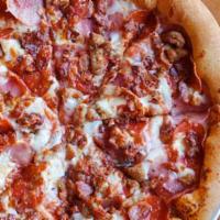 Meateater Pizza · Mozzarella, smoked ham, pepperoni, Italian sausage, crispy bacon and smoked provolone oregano.