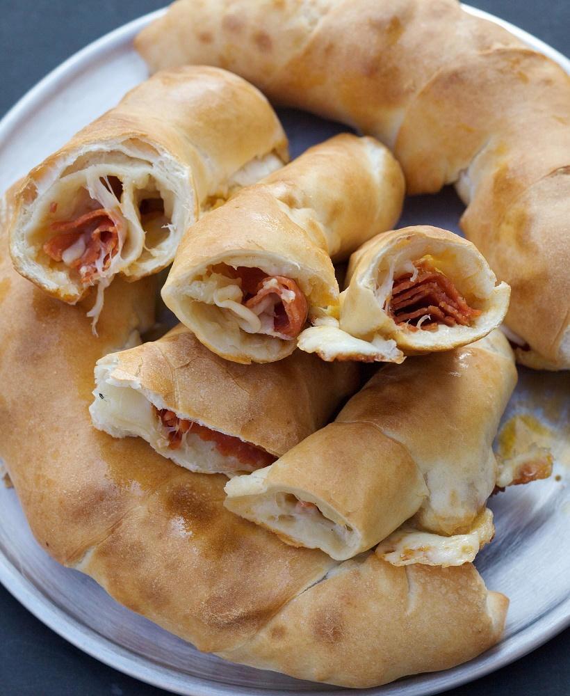 Pepperoni Rolls · Pepperoni and smoked provolone cheese expertly rolled in our hand-tossed original crust. Perfect for dipping in ranch or red sauce (1 sauce cup included with 6 count, 2 cups included with 12 count).