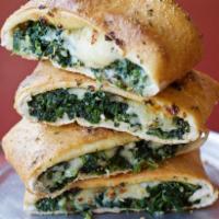 Garlic Spinach Stromboli · Mozzarella, white American cheese, crushed garlic and spinach in folded pizza crust. 
