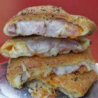 Ham and Cheese Stromboli · Smoked ham, cheddar and white American cheese. Folded in hand tossed original crust, rolled ...
