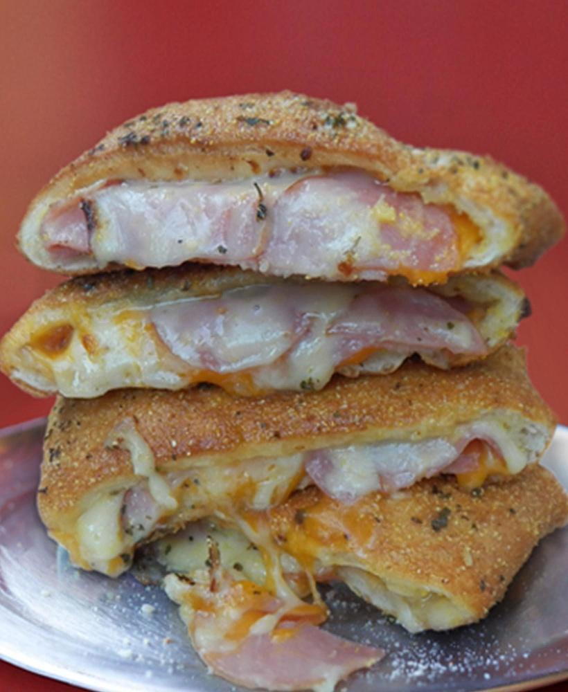 Ham and Cheese Stromboli · Smoked ham, cheddar and white American cheese. Folded in hand tossed original crust, rolled in cornmeal and baked to perfection.
