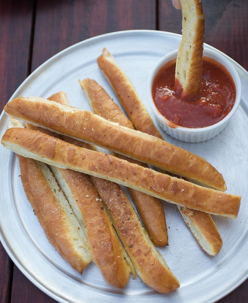 Breadstyxz · Delicious hand-tossed crust cooked to perfection, brushed with garlic butter sauce, then cut into strips. Served with either homemade red sauce or Ranch dressing.