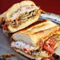 Italian Meatball Sandwich · Sliced Italian meatballs smothered in freshly prepared marinara sauce and topped with smoked...