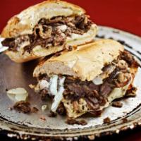 Philly Cheesesteak Sandwich · Seasoned steak, onions, mushrooms, white American cheese and smoked provolone.