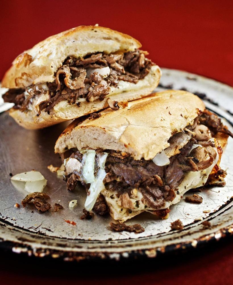 Philly Cheesesteak Sandwich · Seasoned steak, onions, mushrooms, white American cheese and smoked provolone.