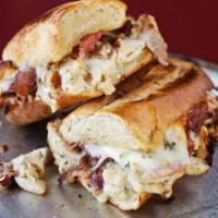Cordon Bleu Sandwich · Grilled chicken breast, smoked ham, crispy bacon, Alfredo sauce and white American cheese.
