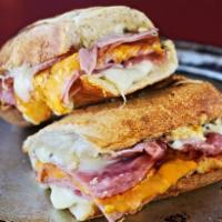Ham and Cheese Sandwich · Smoked ham layered with white American and cheddar cheese. Served toasted on a Tuscan baguet...