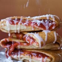 Cherry Strudel · Cherry and cinnamon and sugar filling folded in our original hand-tossed crust and topped wi...