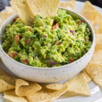 Guacamole & Chips · Our Guacamole is made with Tomato Cilantro and Onion