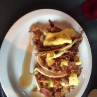 Breakfast Tacos · French toast battered flour tortillas, smoked bacon, scrambled eggs & warm syrup.