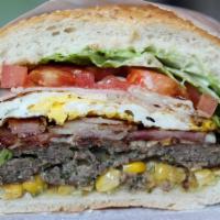 BRAZILIAN MEGA BURGER - ANGUS BEEF (BRAZILIAN X-TUDO) · ANGUS BURGER MEAT, LETTUCE, TOMATO, ONIONS, CHEESE, HAM, BACON AND FRIED EGG TOPPED WITH HOM...