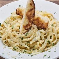 Fettuccine Alfredo with Chicken · delicious home made Alfredo sauce served with fettuccine pasta and tender grilled chicken br...