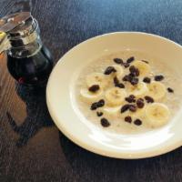 Morning Glory Oatmeal Breakfast · Served with banana and raisins.