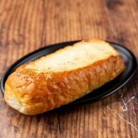 Fuel Injected Garlic Bread · A thick slice of Italian bread grilled, toasted and injected with our savory garlic infused ...