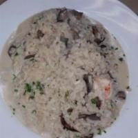 Risotto Tolmino · Arborio rice with shrimps, portobello mushrooms and mascarpone cheese.