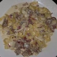 Fettuccine Golose · With prosciutto, sausage and onions in a white wine and cream sauce.