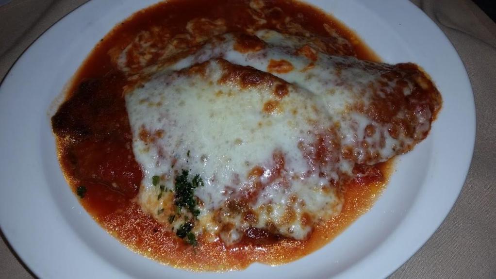 Eggplant Parmigiana with Pasta · Breaded eggplant, baked with tomato sauce and mozzarella. Served with your choice of pasta.