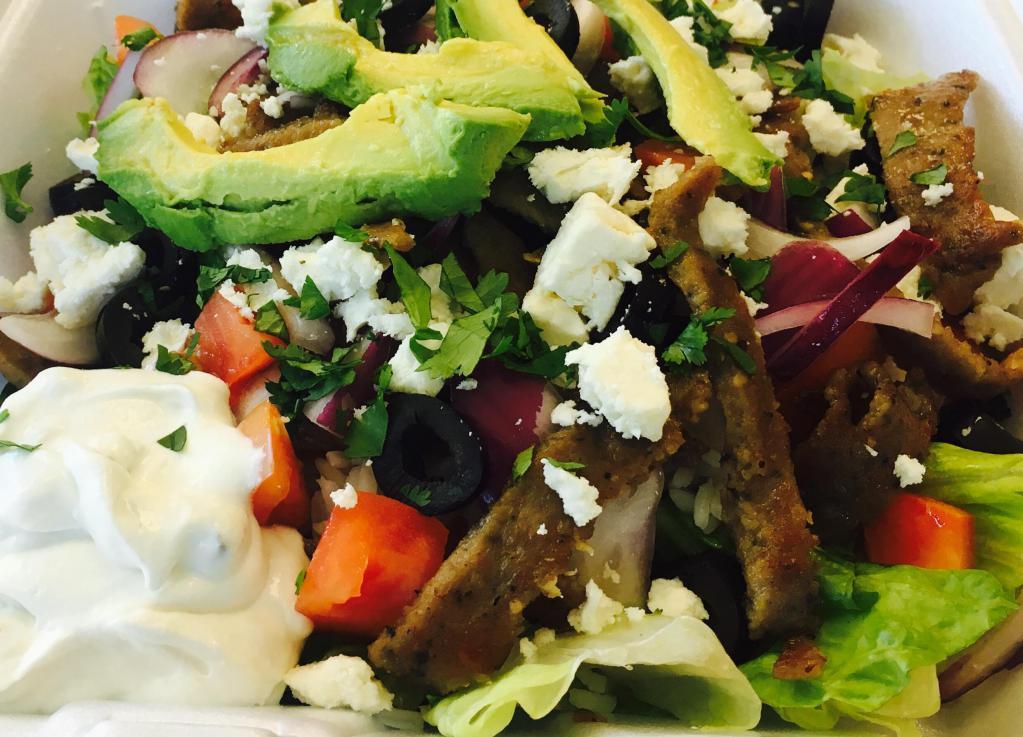 Gyro Rice Bowl · Grilled gyro meat, rice, romaine lettuce, tomato, red onion, cilantro, black olives, feta cheese and cucumber sauce.