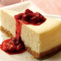 New York-Style Cheesecake Slice · A rich and creamy New York-style cheesecake baked inside a honey-graham crust. Try with swee...