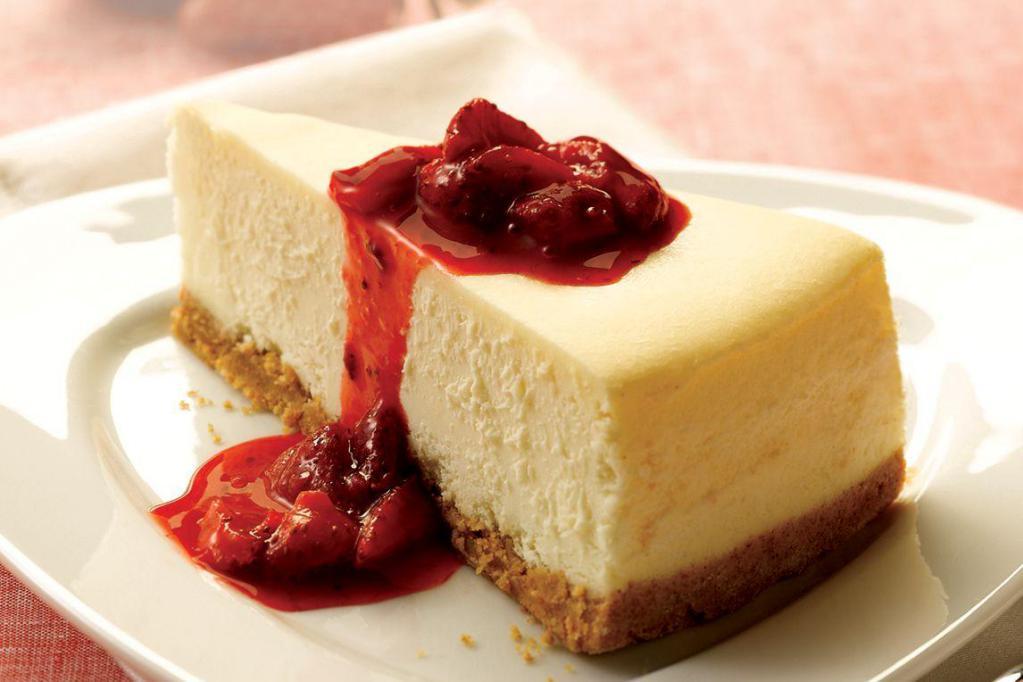 Cheesecake Slice · A rich and creamy New York-style cheesecake baked inside a honey-graham crust. Try with sweet strawberries in strawberry sauce, or with blueberry toppings for an additional charge.