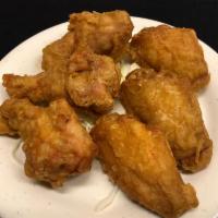 6 Deep Fried Chicken Wings · Cooked wing of a chicken coated in sauce or seasoning.