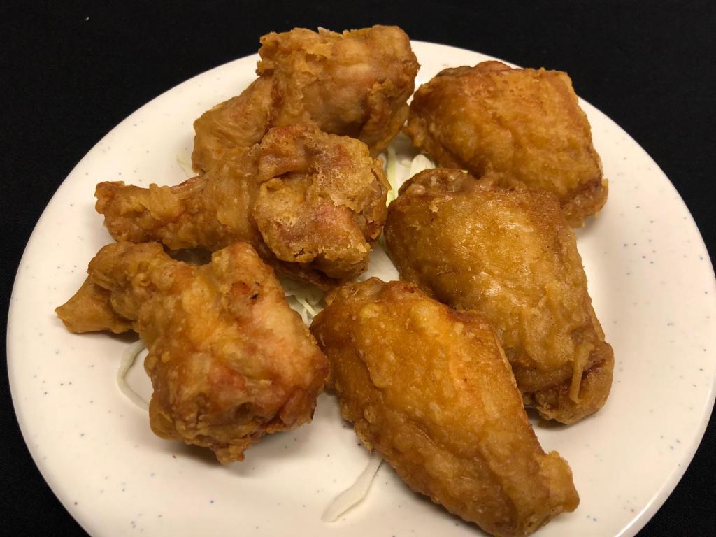 6 Deep Fried Chicken Wings · Cooked wing of a chicken coated in sauce or seasoning.
