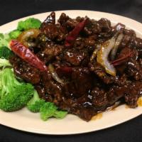 Crispy Beef in Mandarin Style · An all time favorite dish. Thinly sliced flank steak seasoned and coated with lotus flour, d...