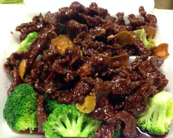 Orange Flavored Beef · Thinly sliced flank steak lightly battered then deep fried, sauteed with broccoli, orange peels, dried red pepper and onion in house special orange flavored sauce. Served with steamed or fried rice.
