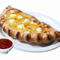 Cheese Lovers Calzone · Homemade tomato sauce, mozzarella cheese, Parmesan, ricotta and cheddar cheese.