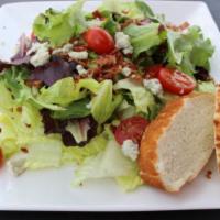 Wedge Salad · Romaine lettuce, cherry tomatoes, bacon, and bleu cheese crumbles.